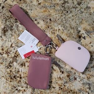 Lululemon Dual Pouch Wristlet in the Spiced Chi and Flushed Pink Colorway